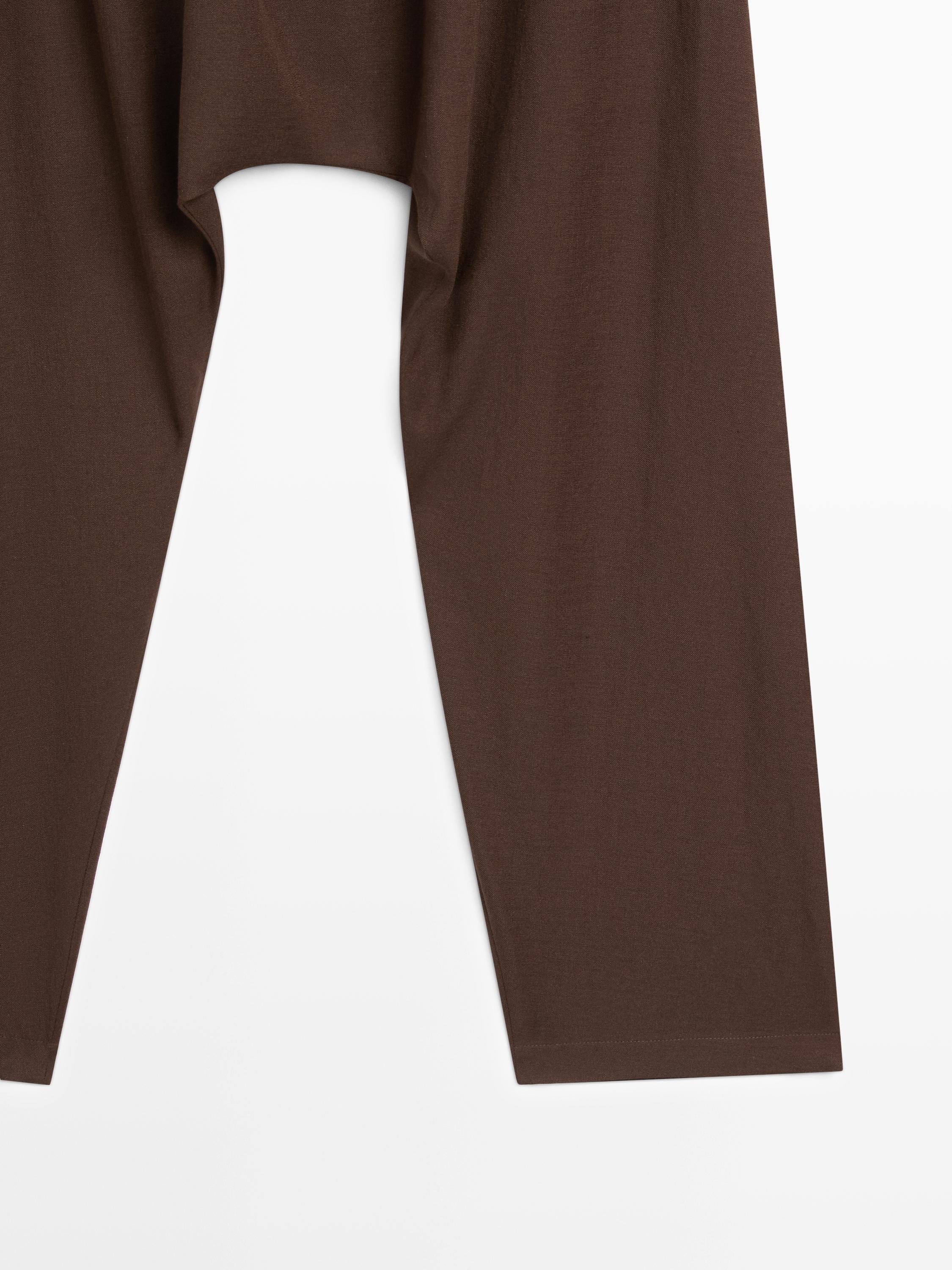 Baggy trousers with pleated details